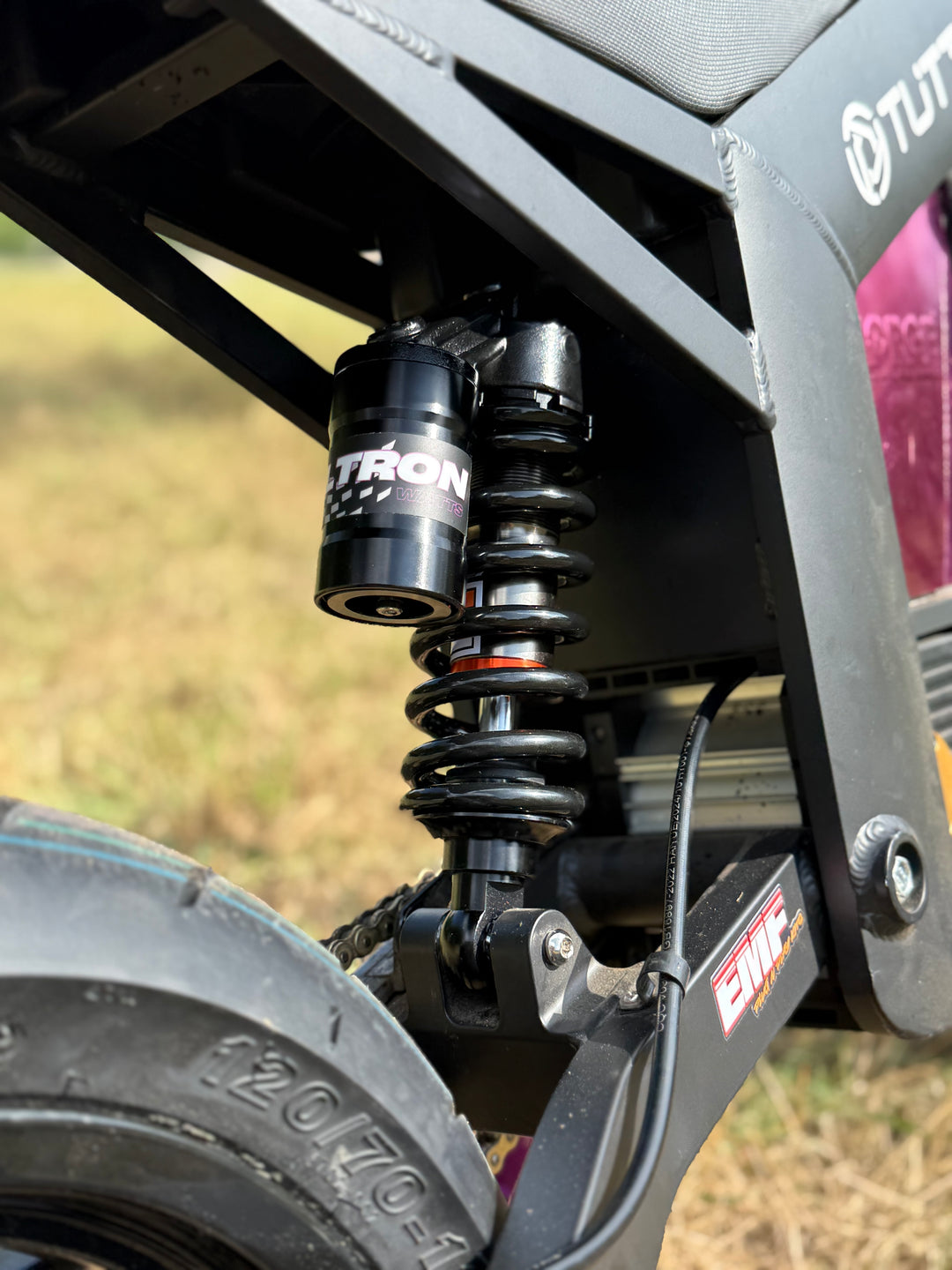 Close-up of a suspension system on a vehicle with 'Norton' branding.