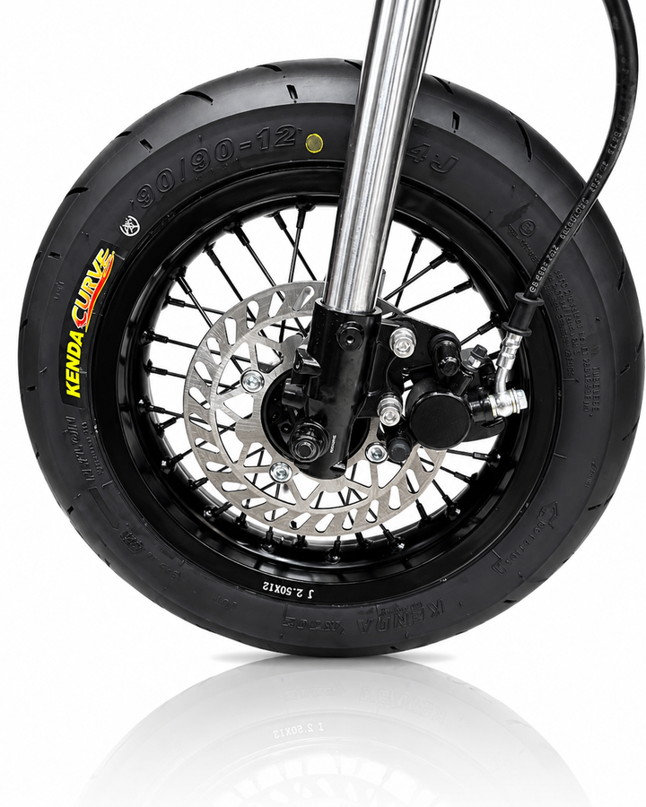 Motorcycle wheel with Kenda tire on a white background