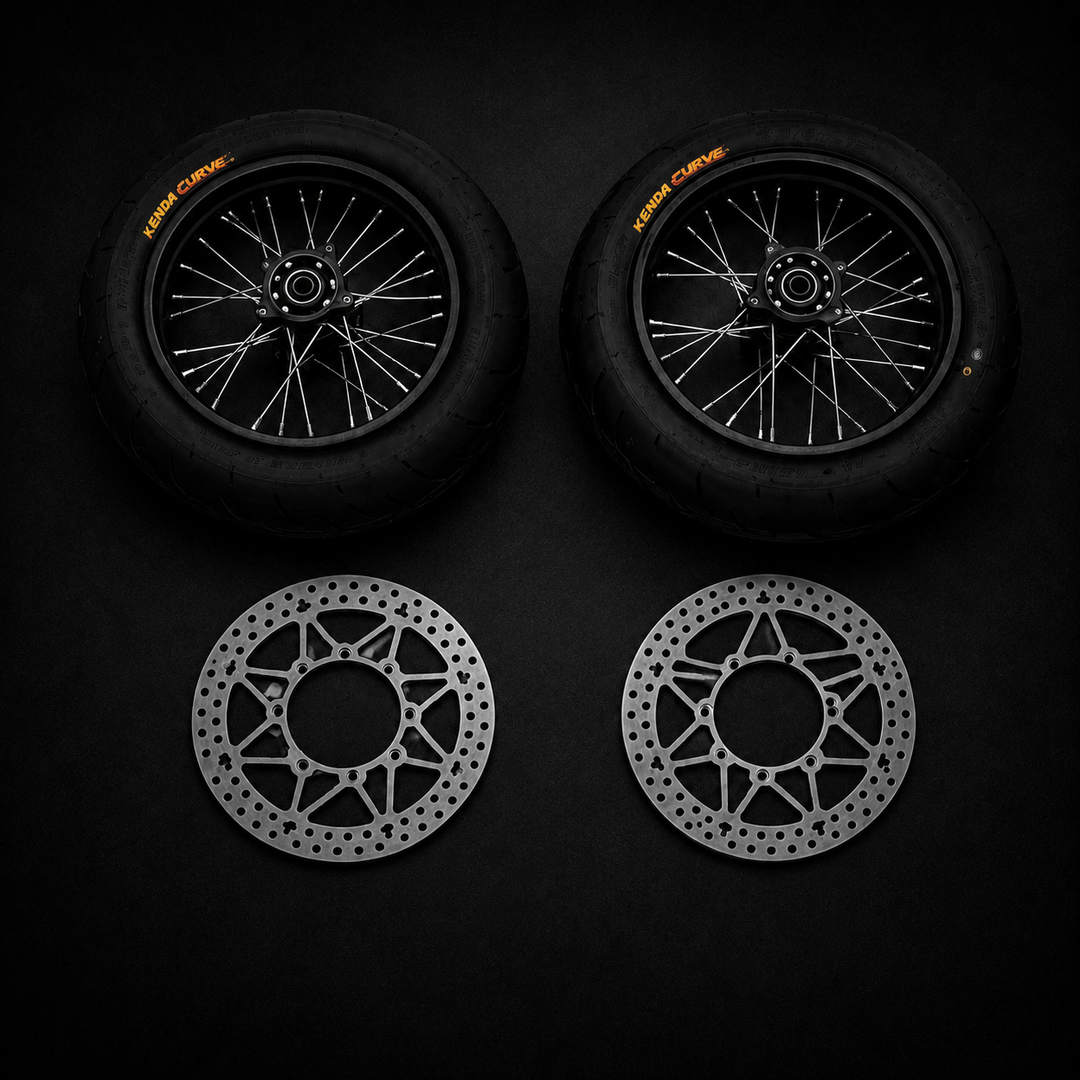 Two motorcycle wheels and two brake rotors on a black background