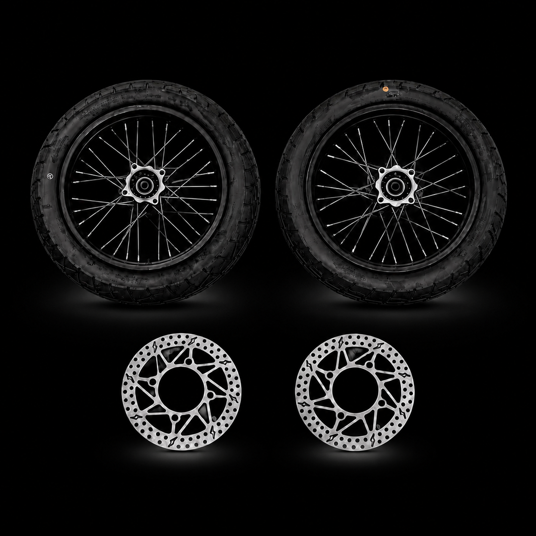 Two motorcycle wheels and two brake rotors on a black background