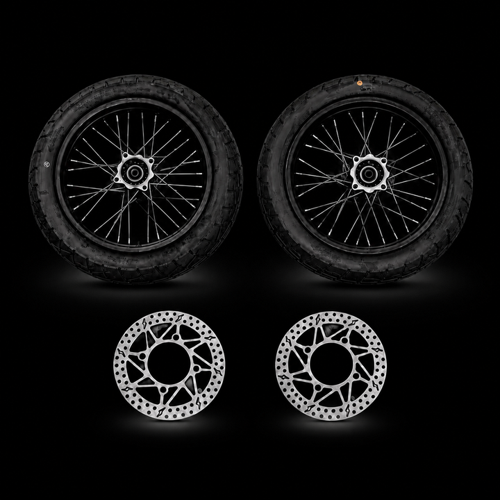 Two motorcycle wheels and two brake rotors on a black background