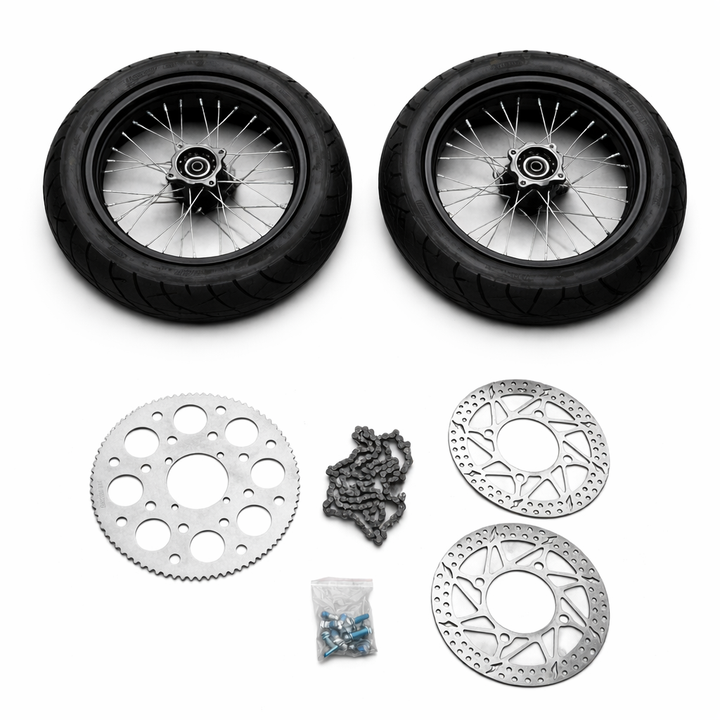 Motorcycle wheels, sprocket, chain, and disc brake rotor on a white background