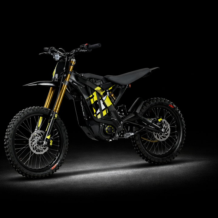Black and yellow dirt bike on a dark background
