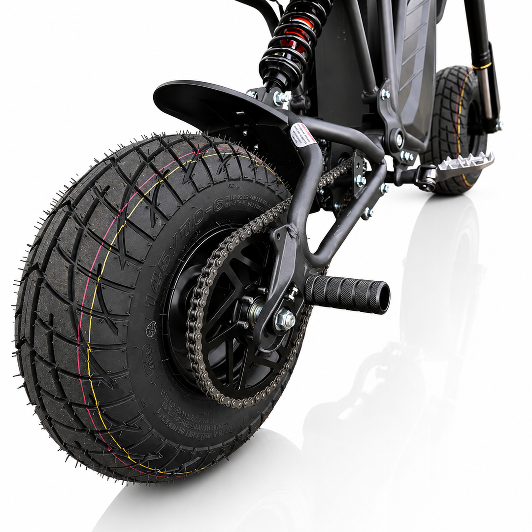 Close-up of a motorcycle wheel with knobby tire on a white background