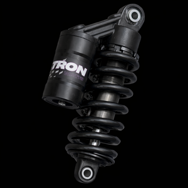 Black shock absorber with 'Ytron' branding on a black background