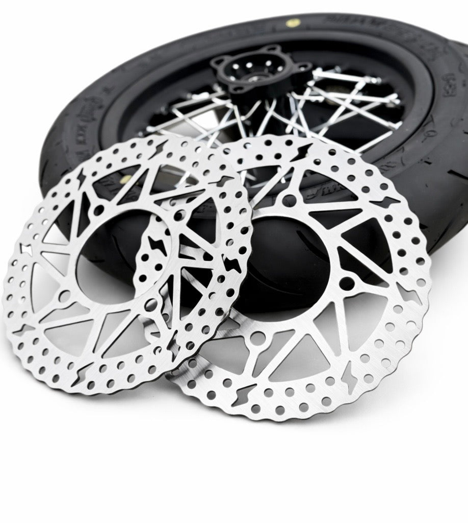 Close-up of bicycle disc brakes with a white background