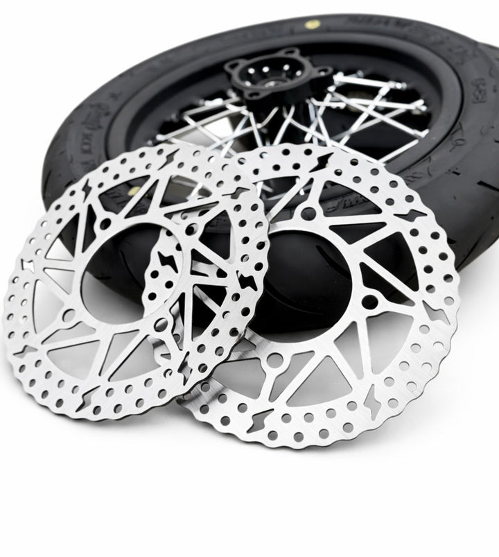 Close-up of bicycle disc brakes with a white background