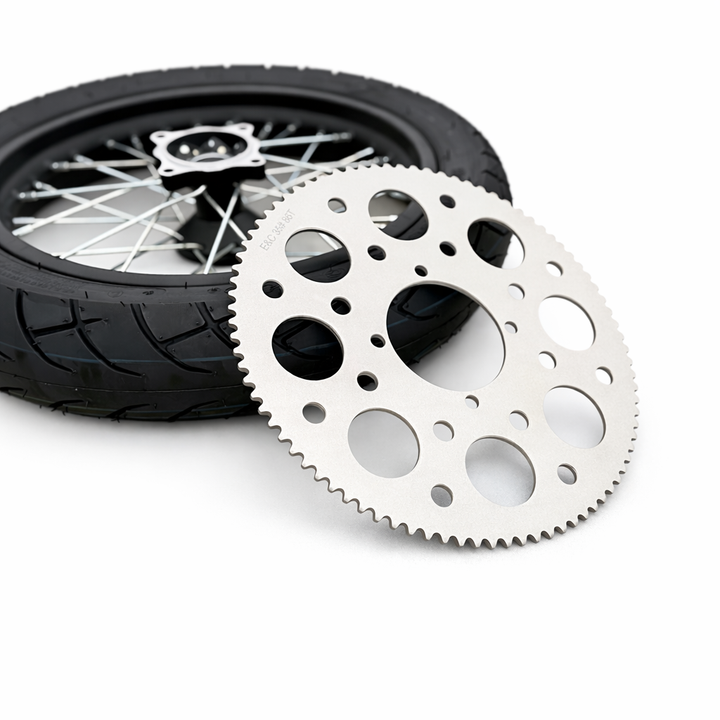 Motorcycle wheel and sprocket on a white background