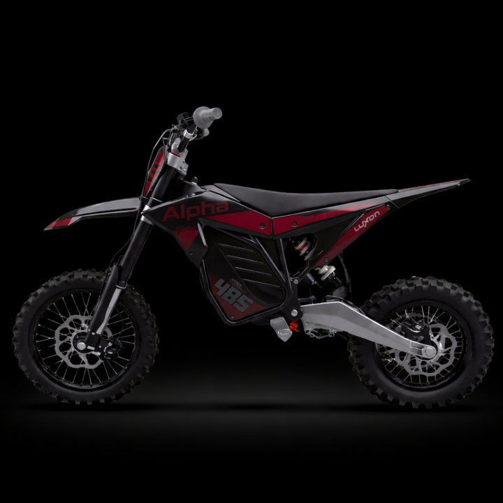 Black and red dirt bike on a black background