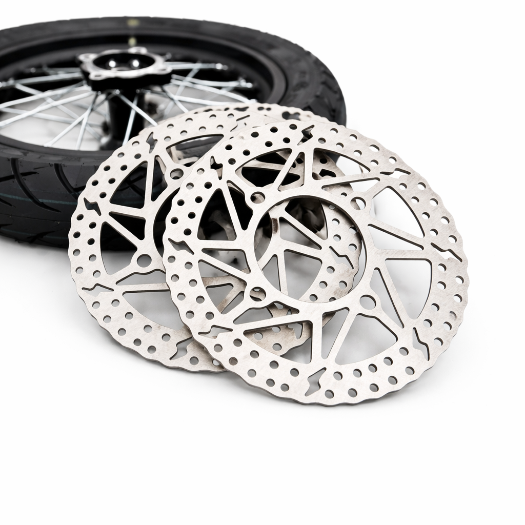 Motorcycle brake disc with a wheel in the background on a white background
