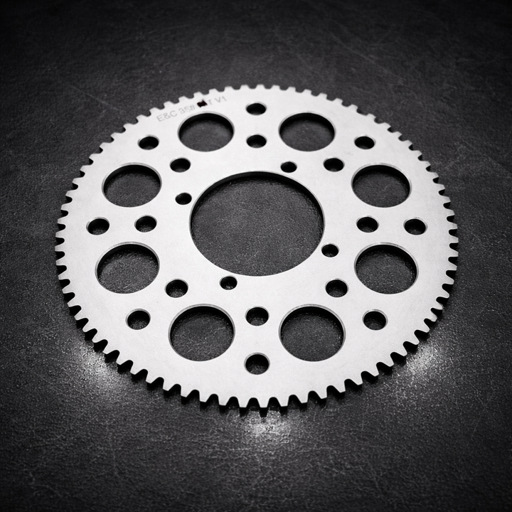 Metal gear on a dark textured surface