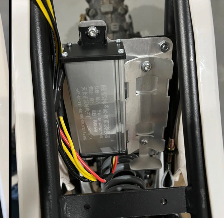Close-up of electronic components with wires inside a device