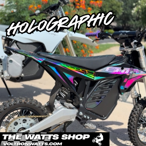Motorcycle with holographic design and 'The Watts Shop' branding.