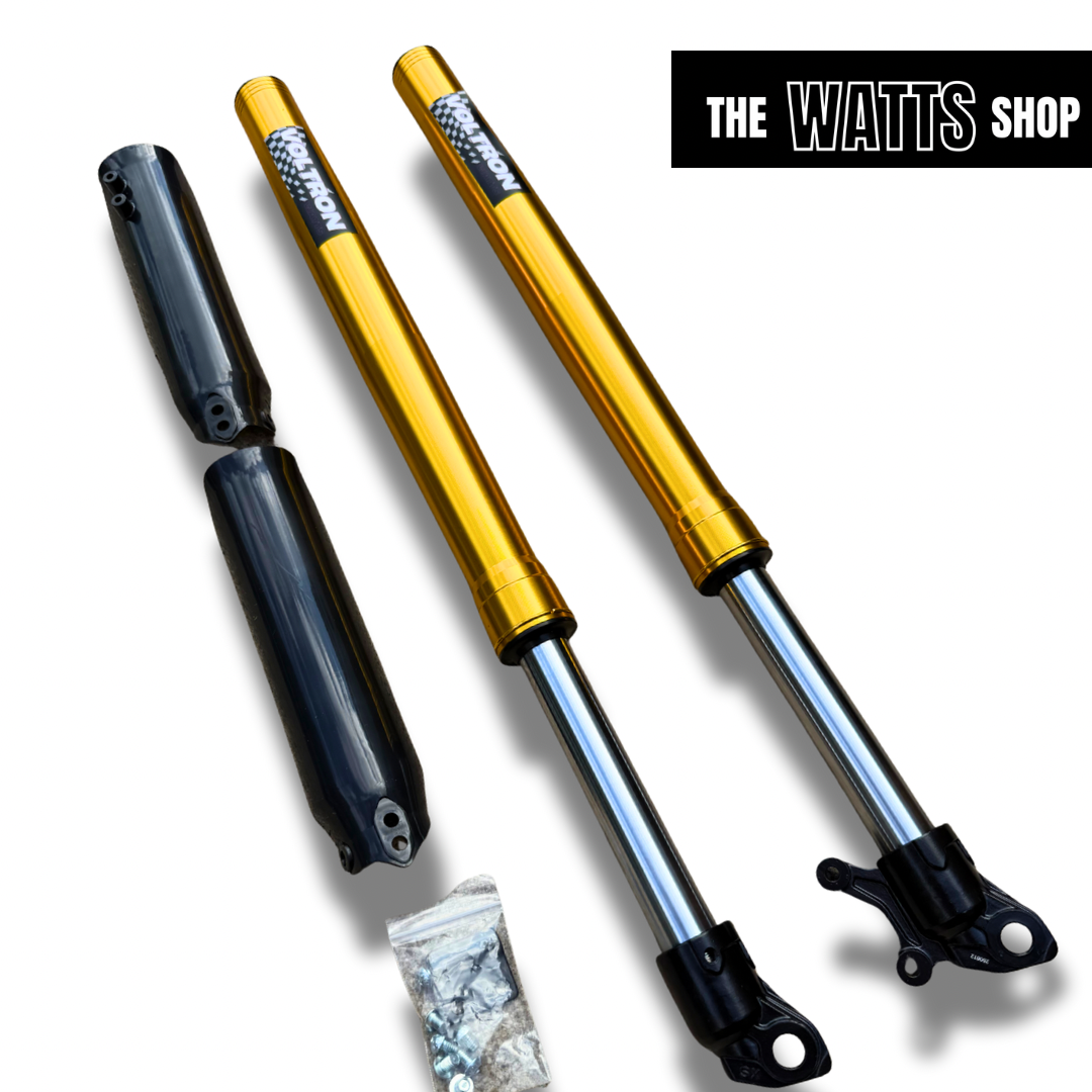 Two gold shock absorbers for Tuttio Soleil with visible branding on a white background, featuring 'The Watts Shop'.