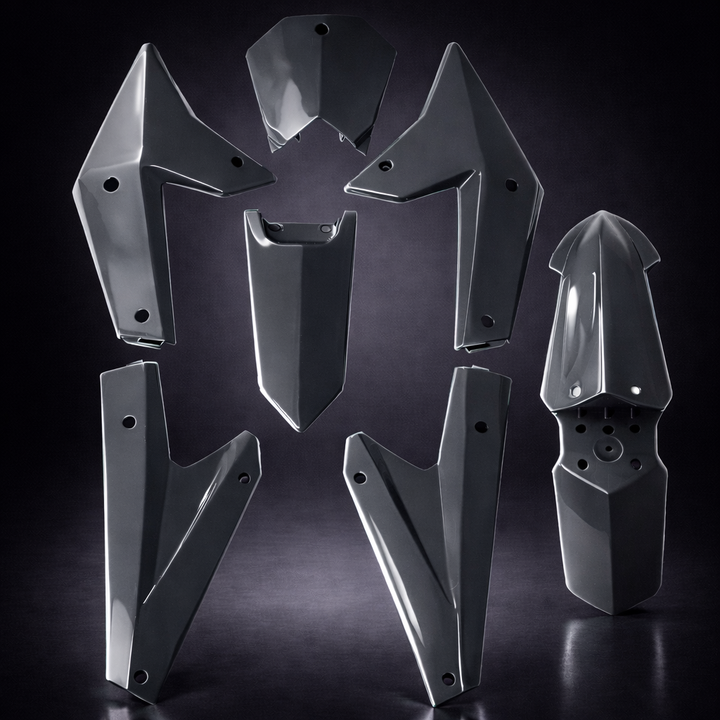 Set of metallic protective armor pieces on a dark background