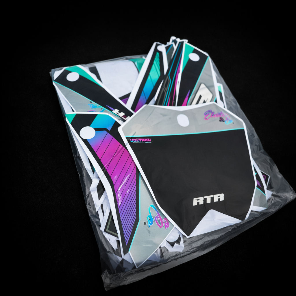 Collection of colorful gaming accessories in a clear plastic bag on a black background
