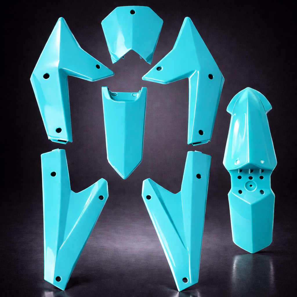 Turquoise motorcycle fenders on a black background