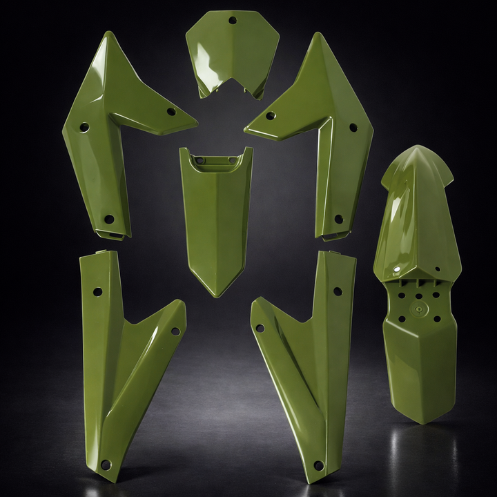 Set of green motorcycle fenders on a dark background