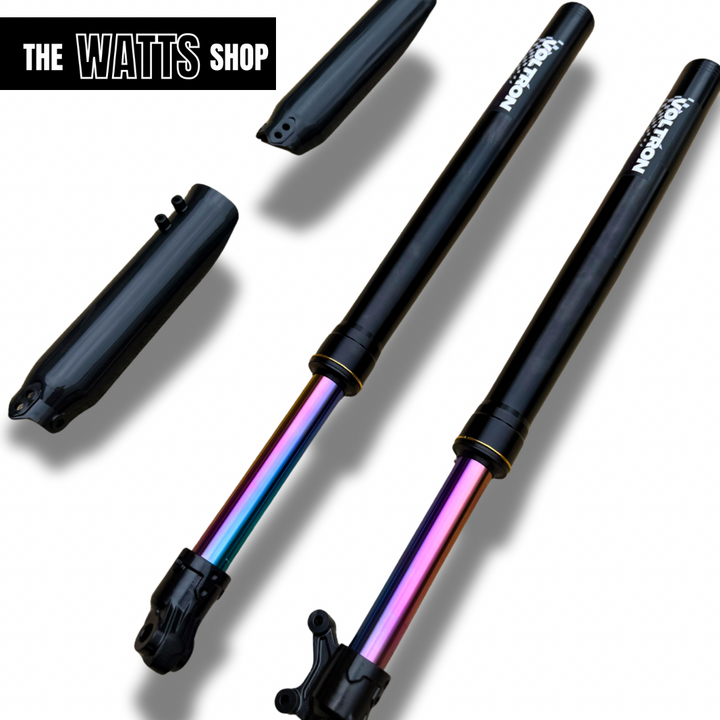 Two Tuttio Soleil 01 shock absorbers with colorful internals on a white background, branded 'The Watts Shop'.