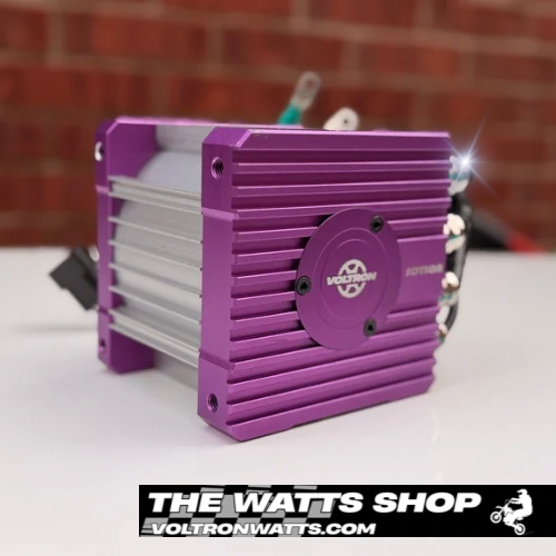 Purple and silver electronic component with Voltron logo on a white surface, branded 'The Watts Shop'.