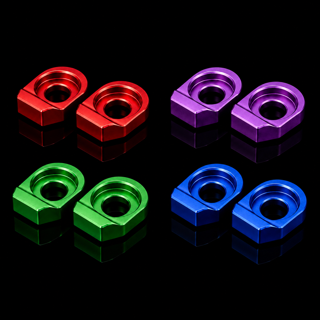 Set of red, purple, green, and blue metal nuts on a black background