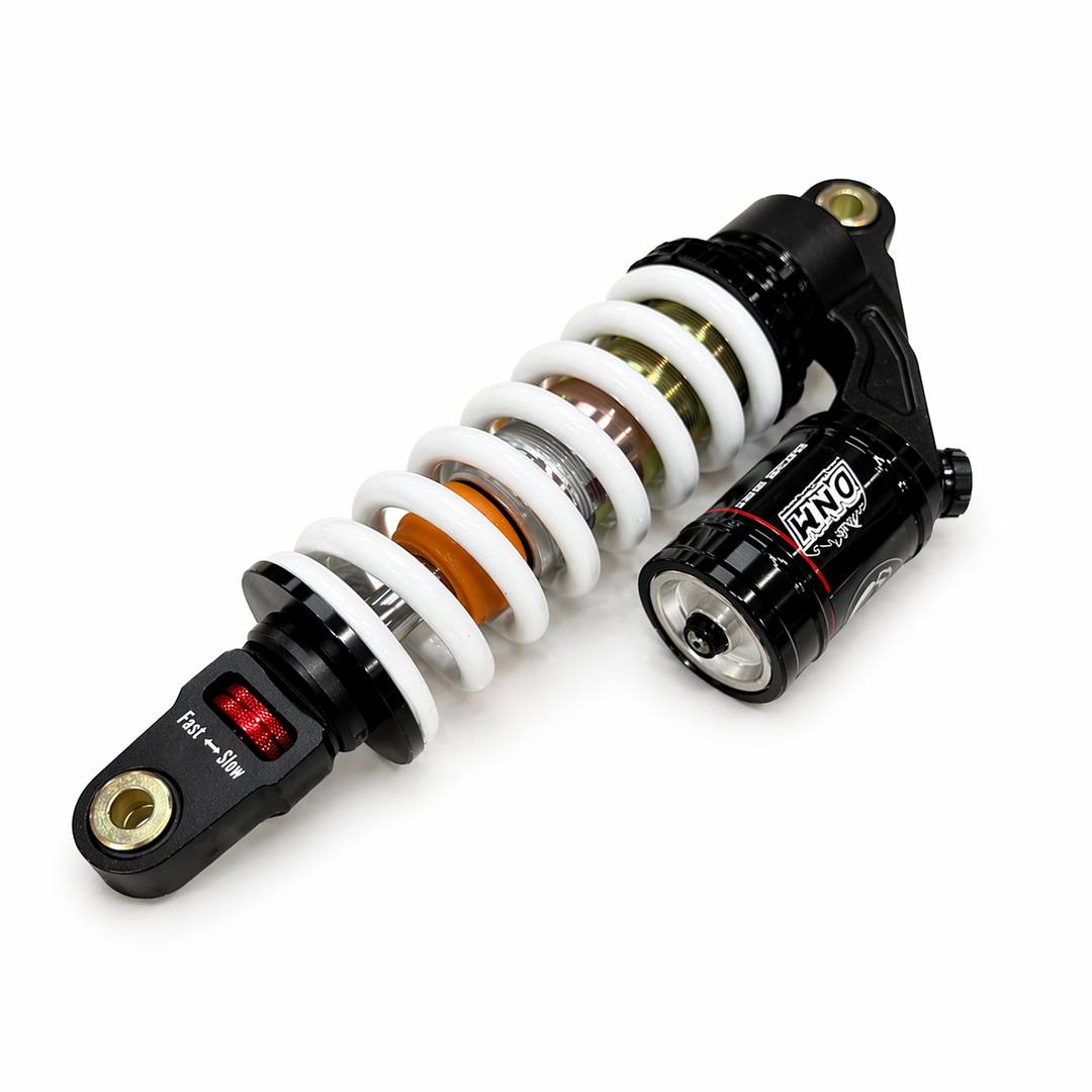 Motorcycle shock absorber with visible brand logo on a white background