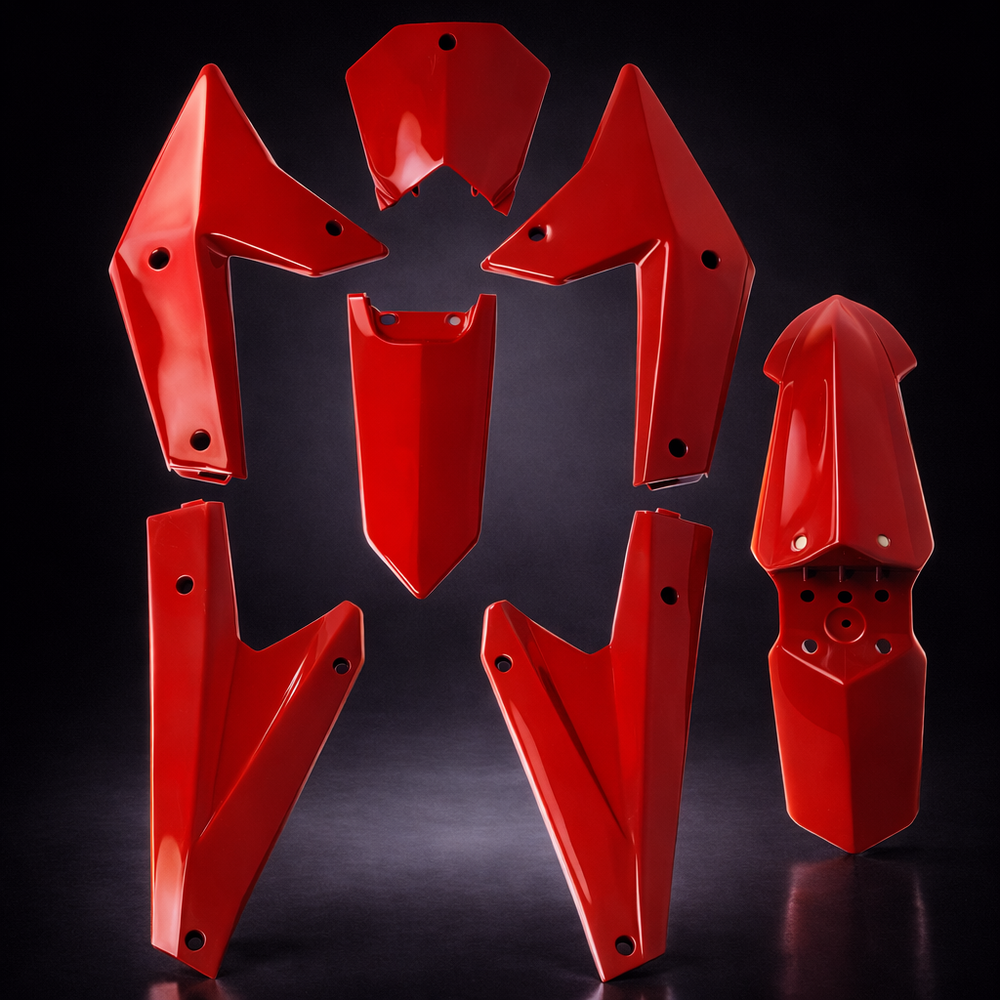 Red motorcycle protective parts on a black background