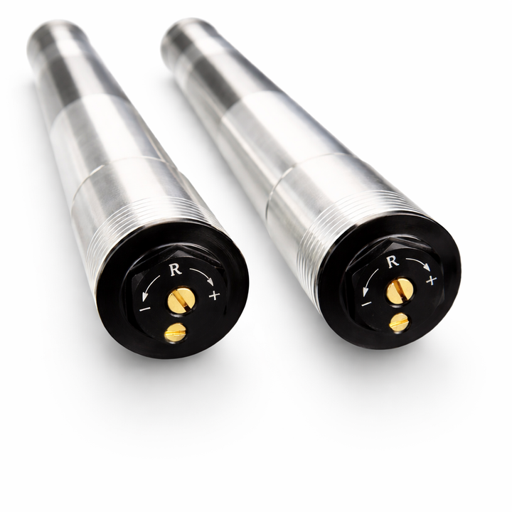 Two metallic connectors with black ends on a white background