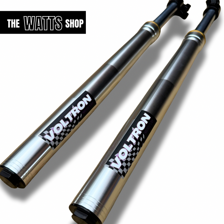 Two silver tuttio Soleil shock absorbers with 'Voltron' branding on a white background, featuring 'The Watts Shop' logo.