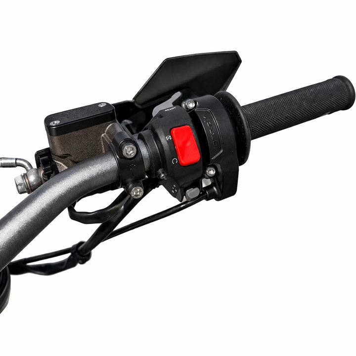Close-up of a motorcycle handlebar with control panel on a white background