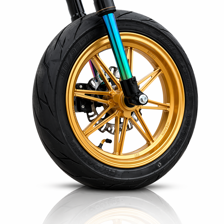 Motorcycle wheel with gold rim and black tire on a white background