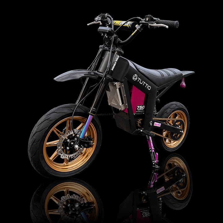 Black electric bike with gold wheels on a black background