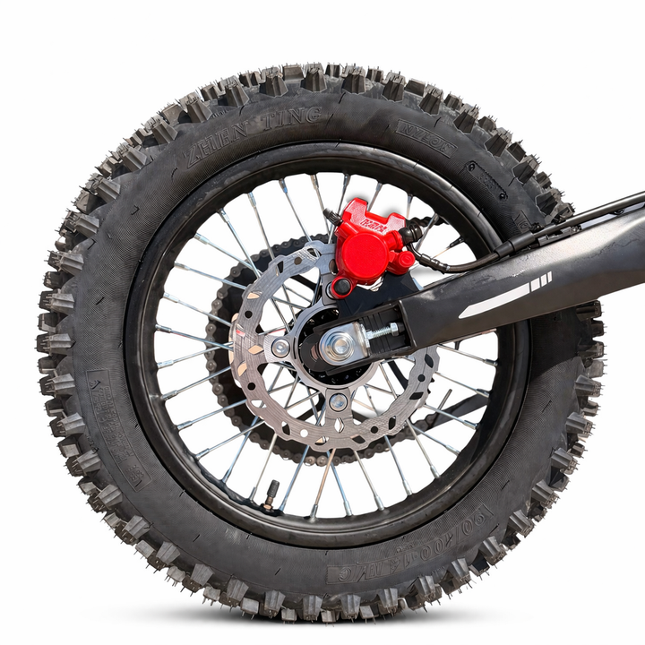 Motorcycle wheel with knobby tire on a white background