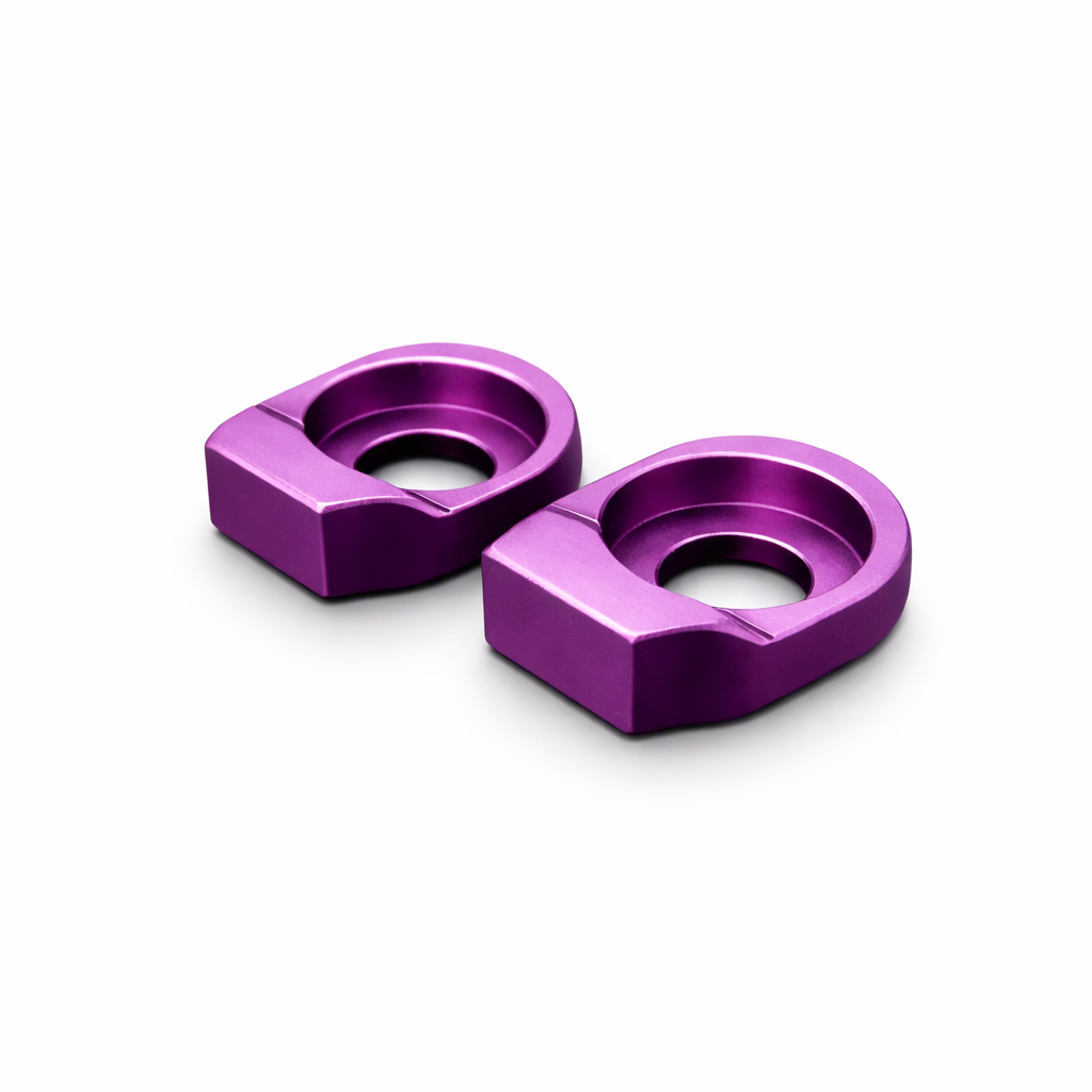 Two purple metal washers on a white background