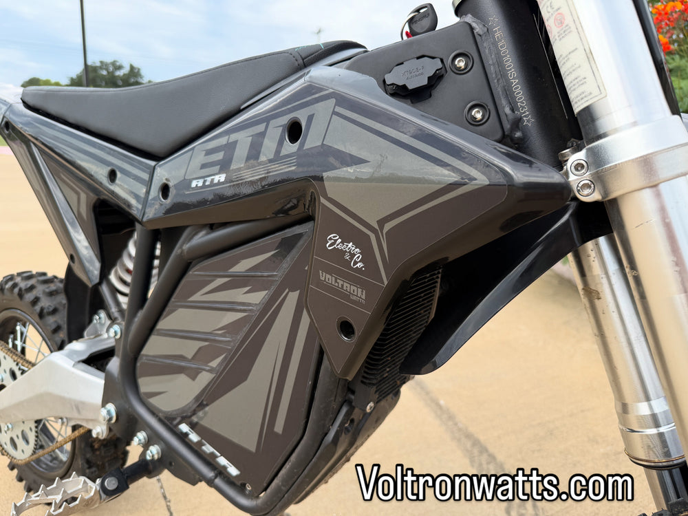 Close-up of a motorcycle with 'ETN' branding on a blurred background