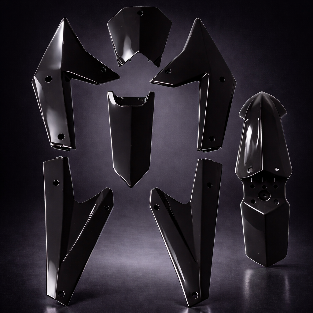 Black metal motorcycle parts on a dark background