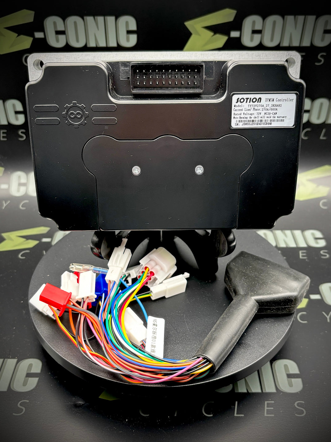 Electronic module with wiring on a stand against a branded background