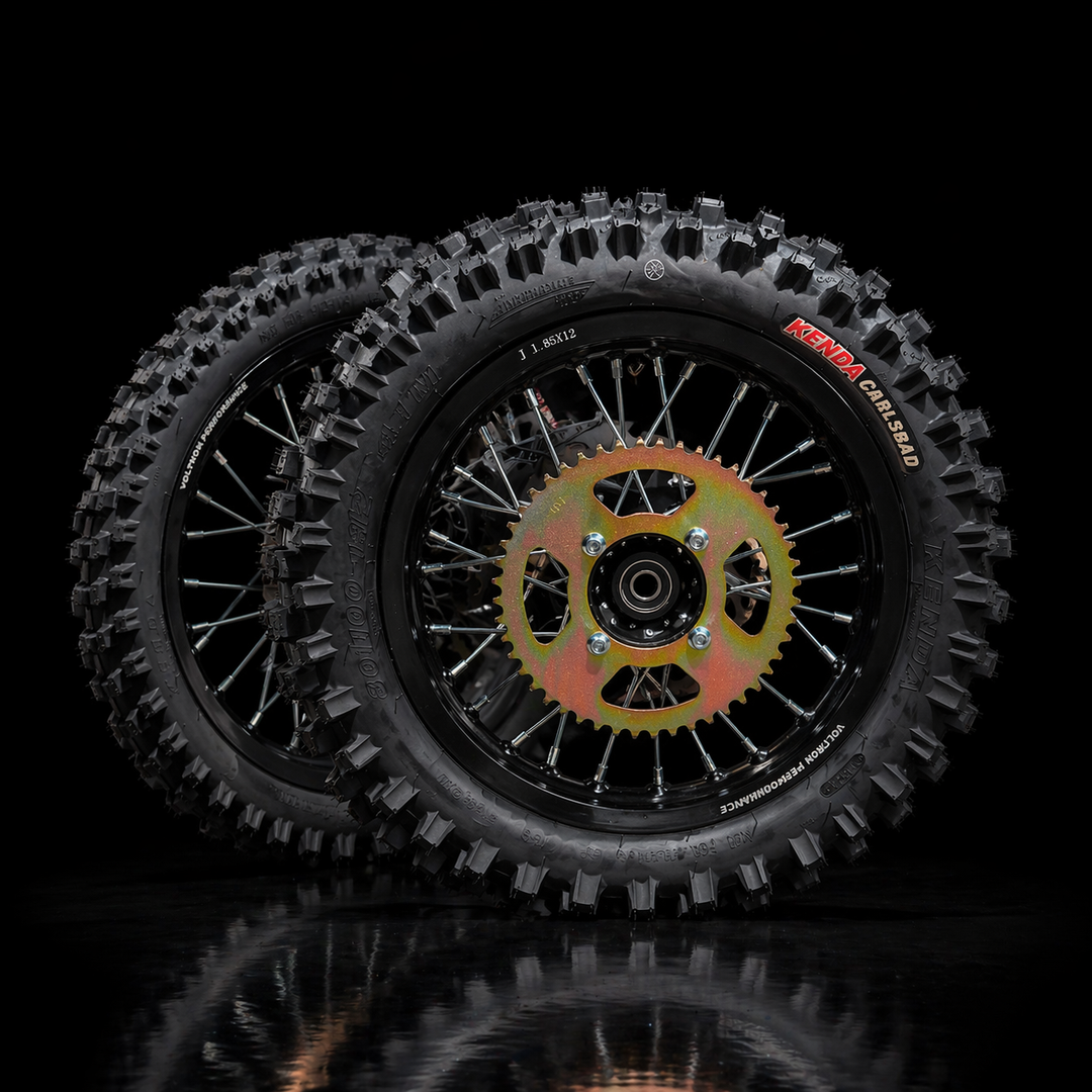 Motorcycle wheels with knobby tires on a black background
