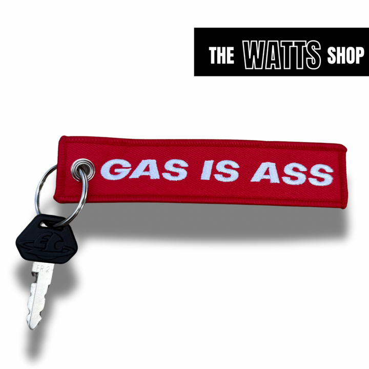 red key chain with white back ground with a ETM RTR key