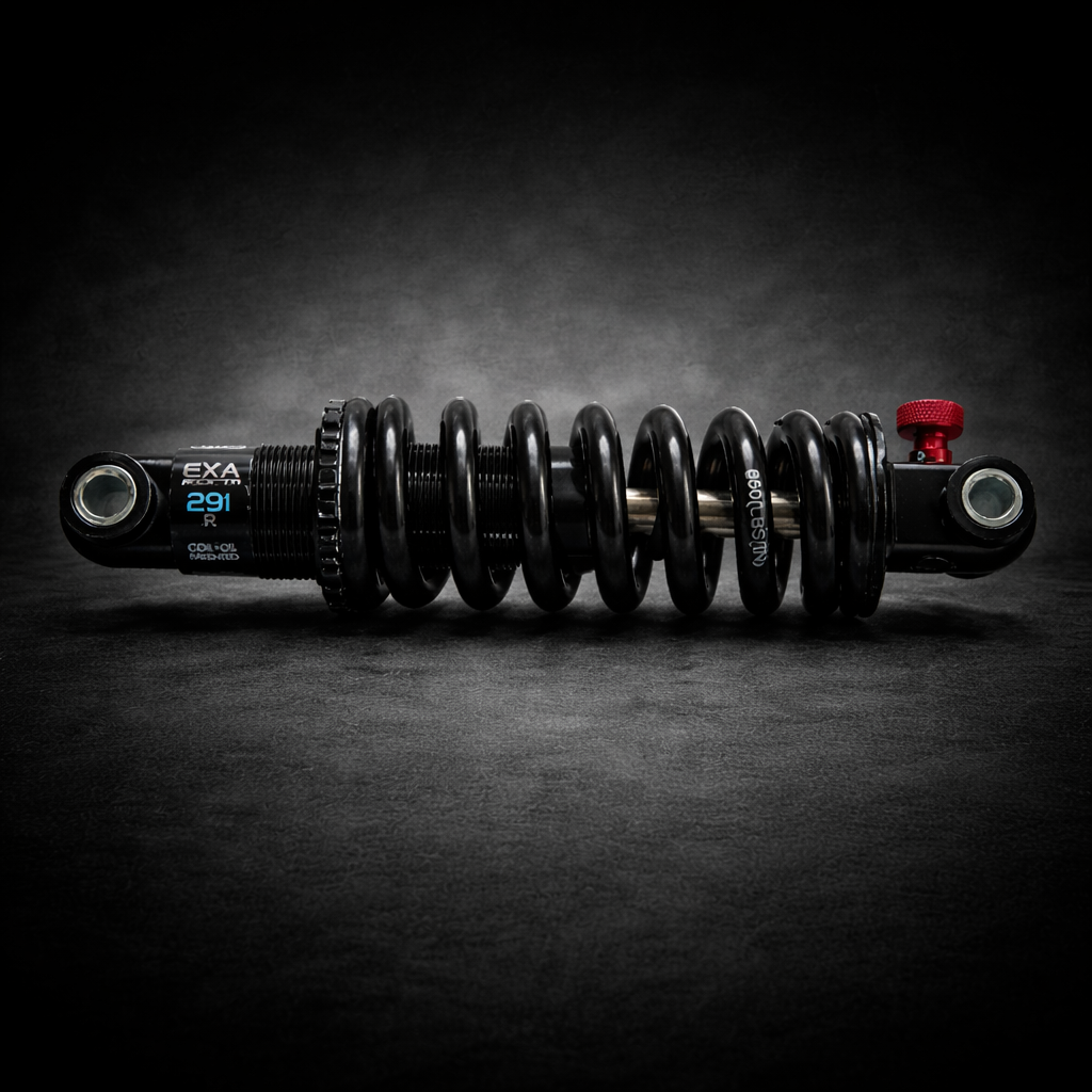 Motorcycle shock absorber with EXA branding on a dark background