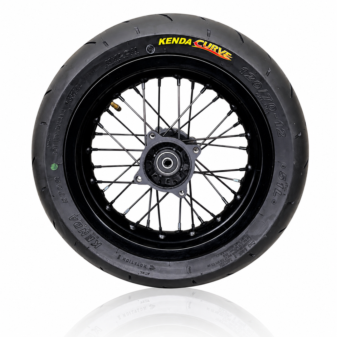Motorcycle wheel with Kenda Curve tire on a white background