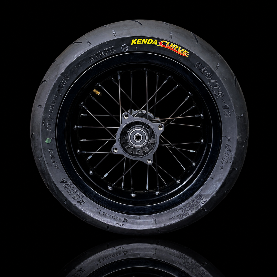 Kenda Curve bicycle wheel on a black background