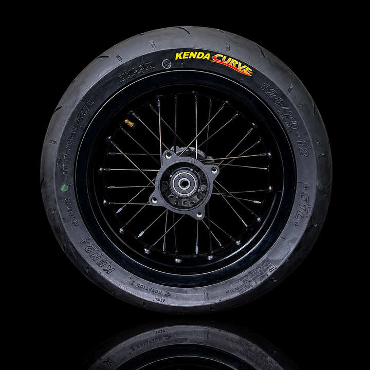 Kenda Curve bicycle wheel on a black background