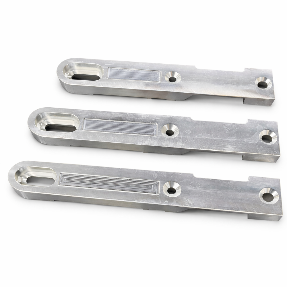 Three metallic brackets on a white background