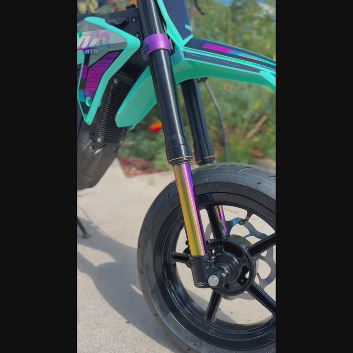 RTR dirt bike on concert with a green plant in the background