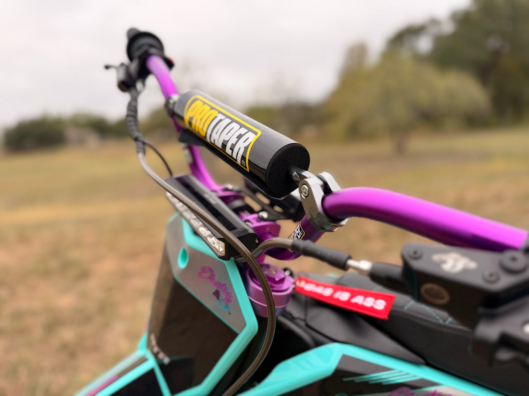 purple pro taper handle bars on a ETM RTR