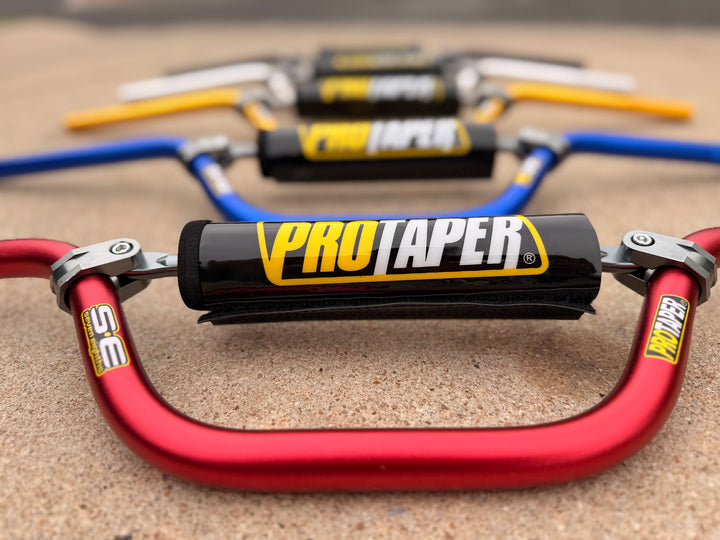ProTaper motorcycle handlebar risers on a sand surface