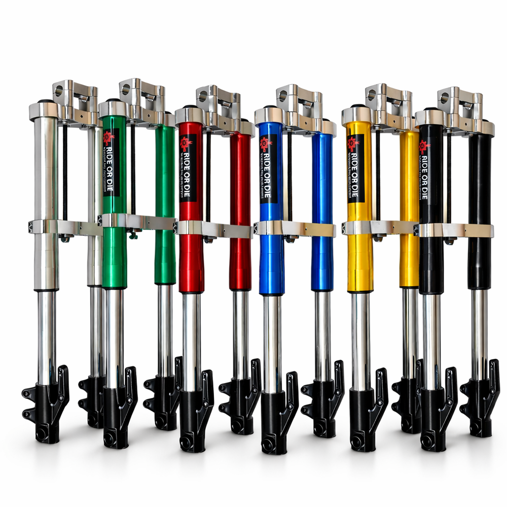 Set of motorcycle shock absorbers in various colors on a white background