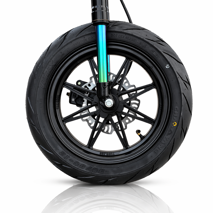 Close-up of a motorcycle wheel with a white background