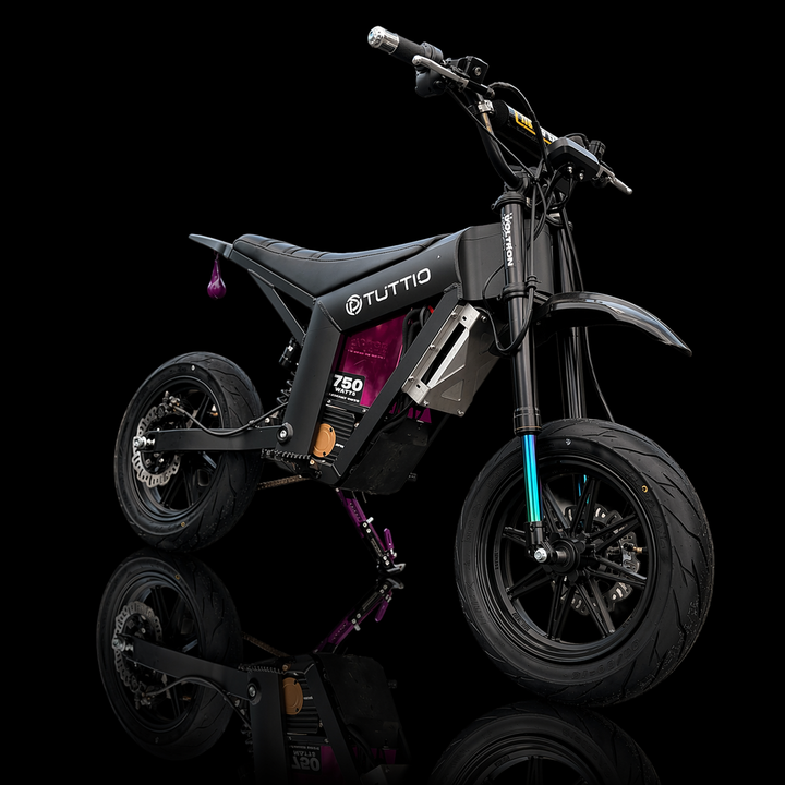 Black electric bike with 'Tuttio' branding on a black background